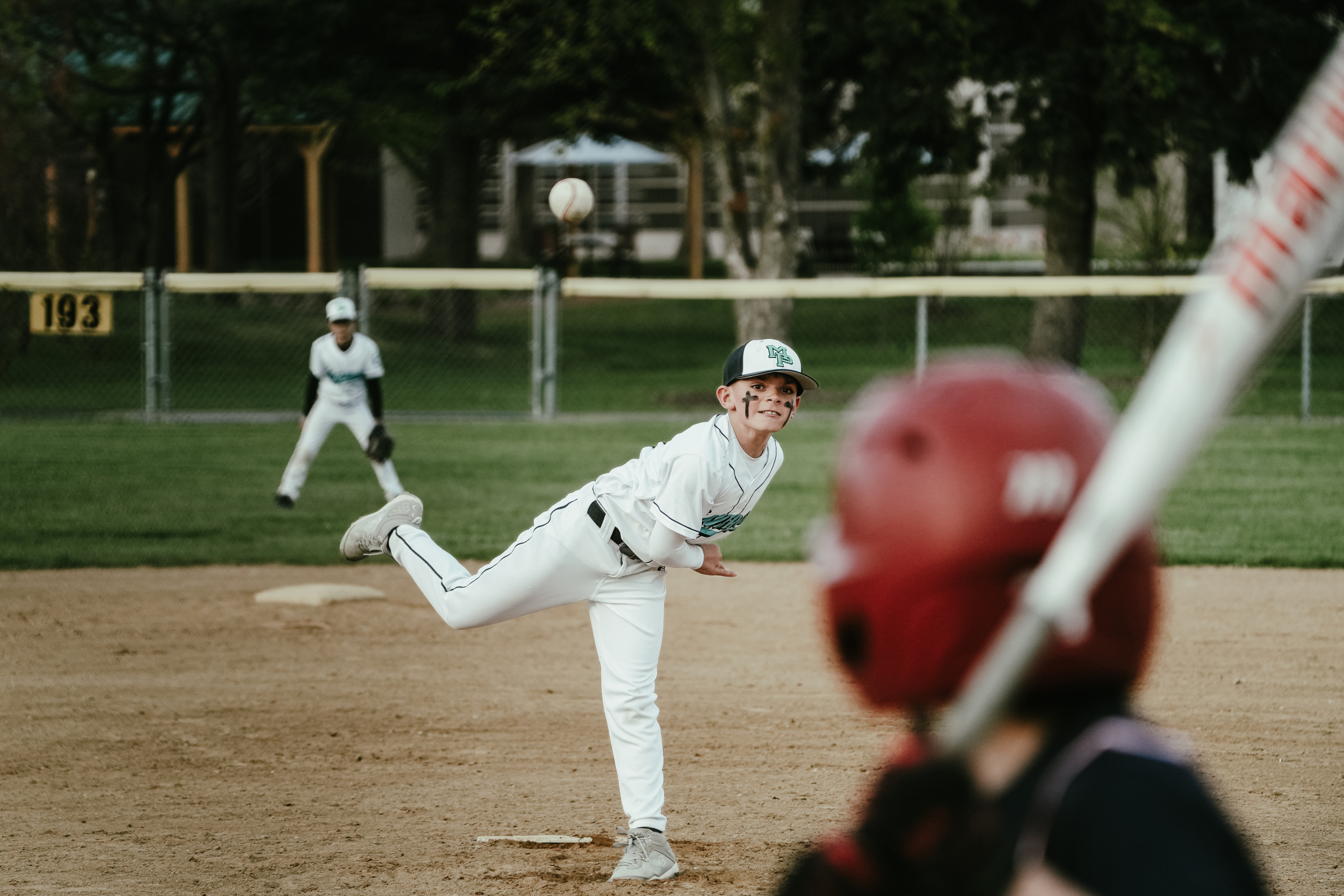 Pitcher's follow-through with ball mid-flight