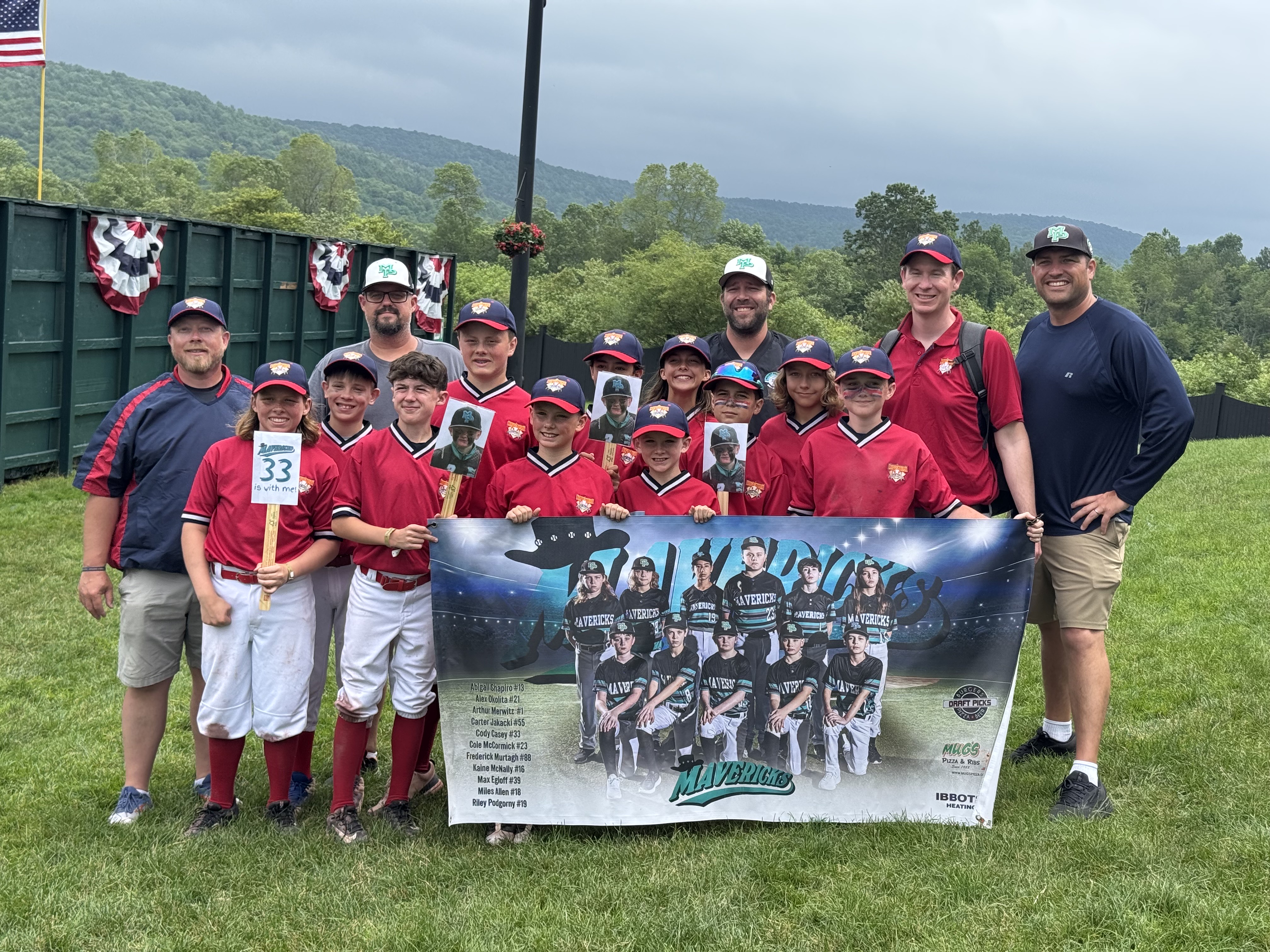 12U Mavs at Cooperstown Dreams Park with team banner