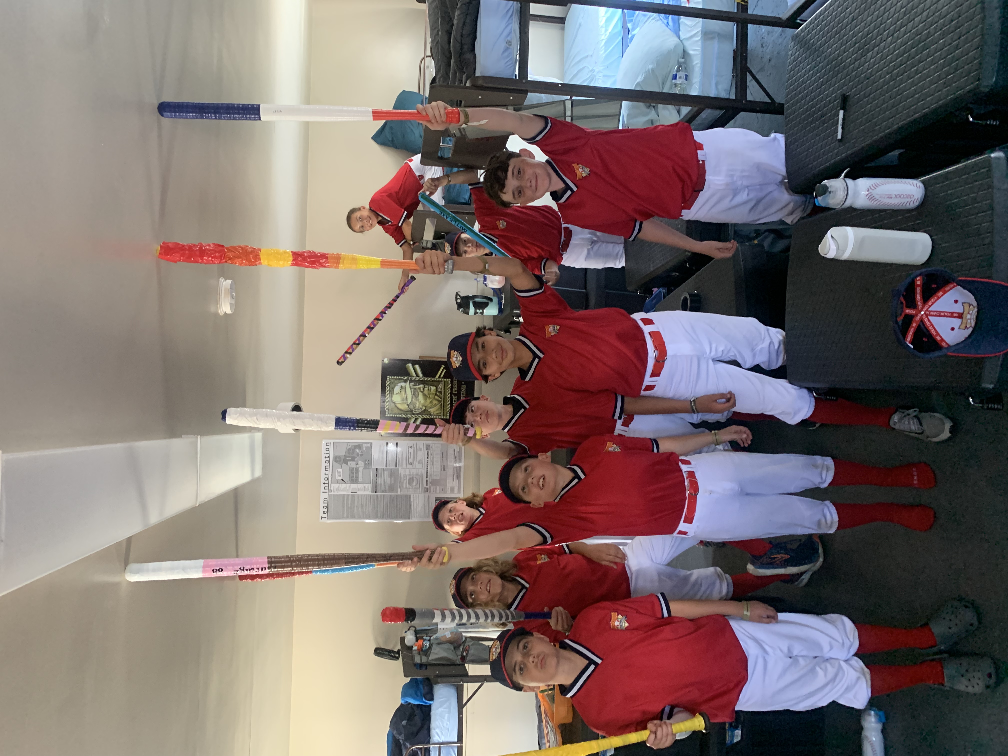 Mavs players holding their decorated Cooperstown bats