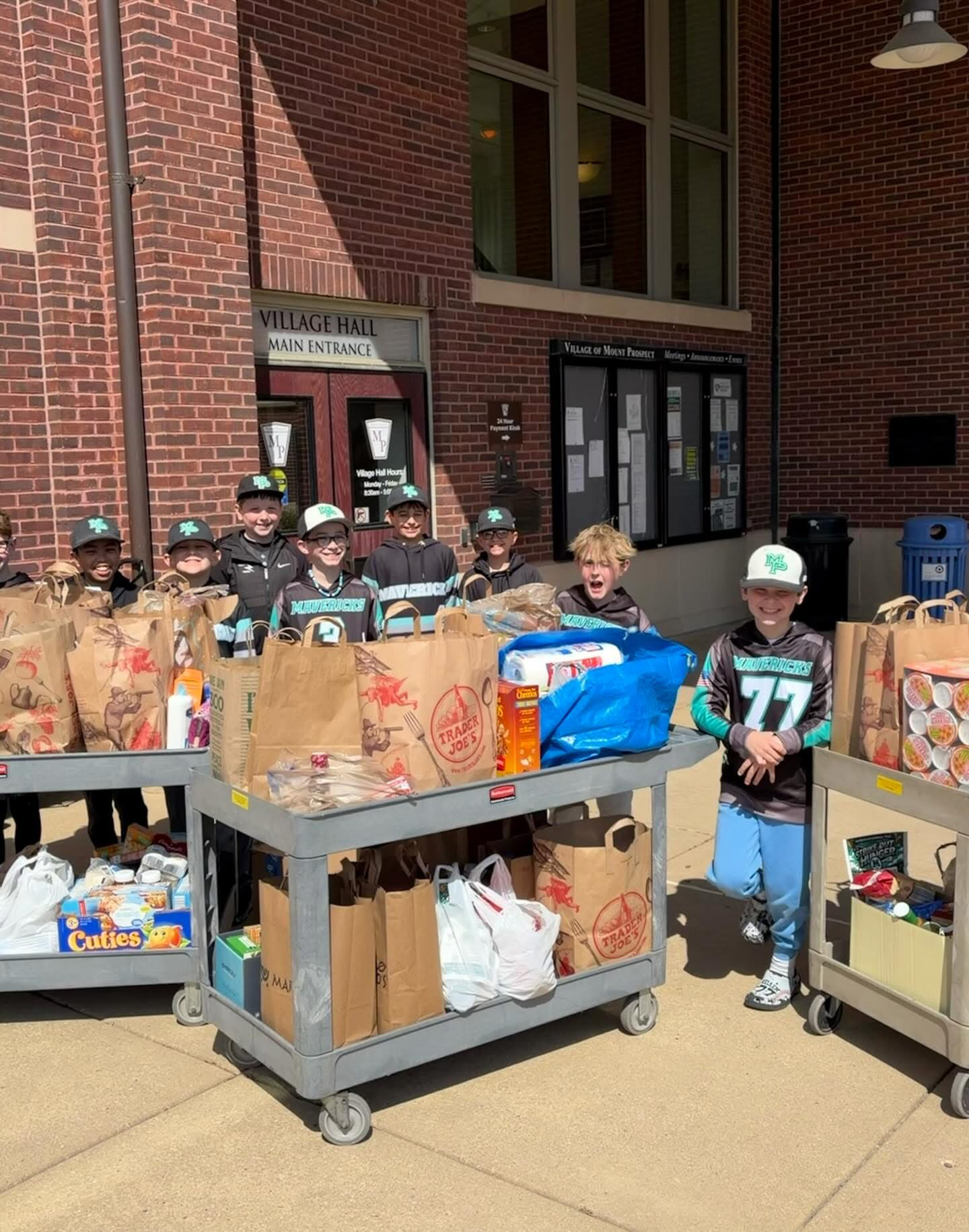 Mavericks team food drive at Mount Prospect Village Hall