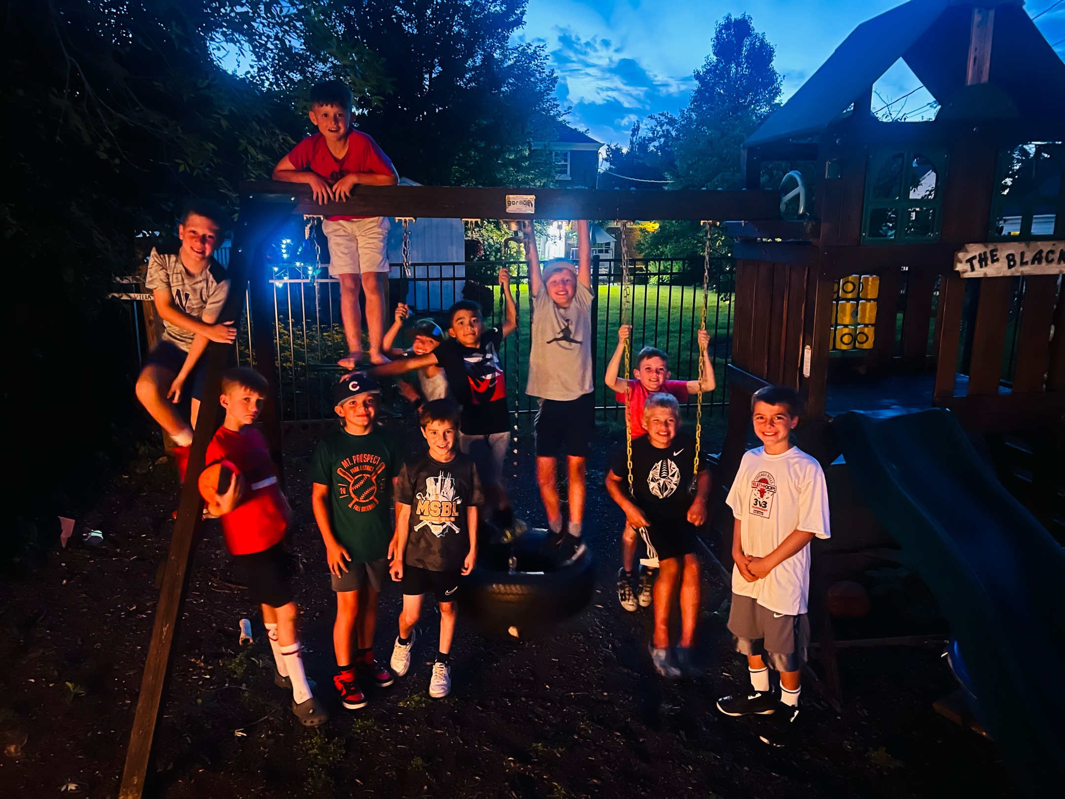 Mavericks team hanging out at a playground at night